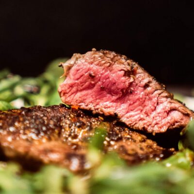 Savour a succulent steak cooked to perfection, nestled on a bed of fresh greens at our luxury hotel's gourmet restaurant.
