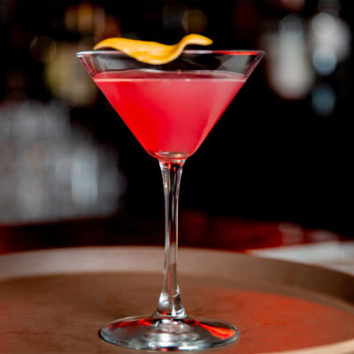 Elegant cocktail in a chic hotel bar setting with ambient lighting, perfect for relaxing evenings.